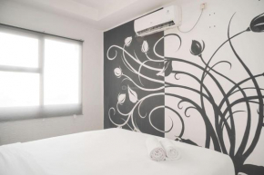 Minimalist and Cozy Living 1BR Belmont Residence Puri Apartment By Travelio